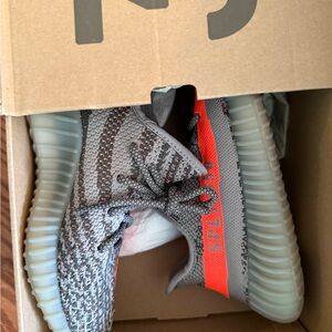 Yeezy Gray and Orange Athletic Shoes with Knitted Upper